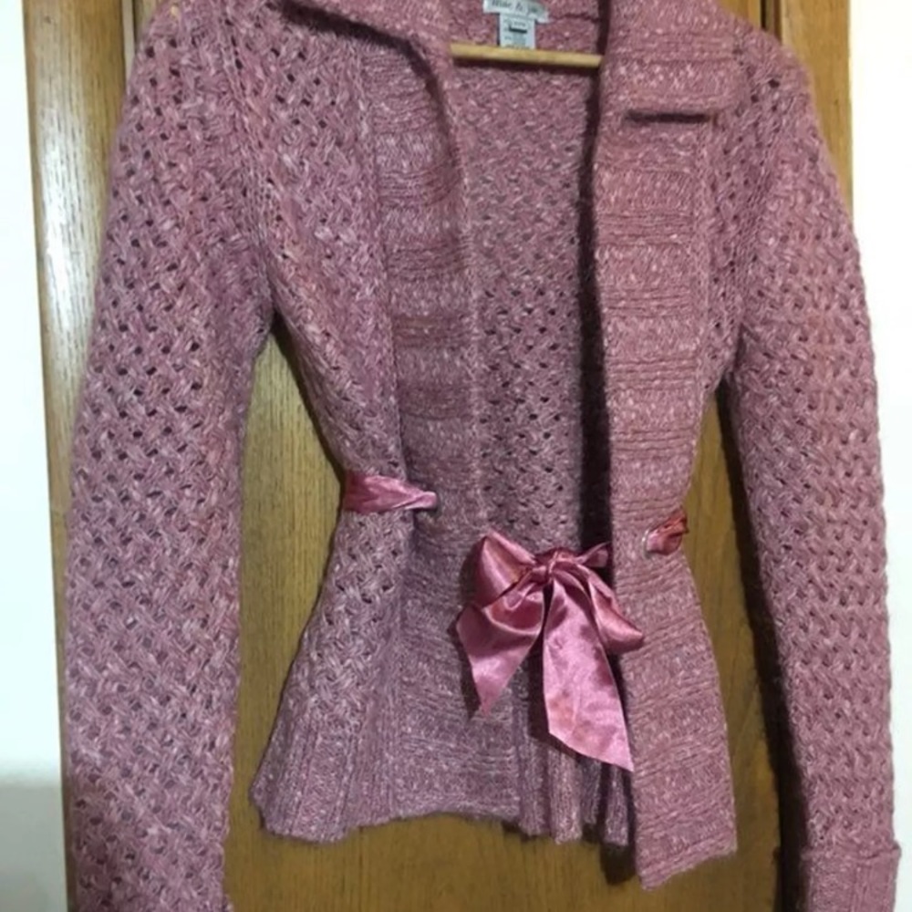 Pink sweater with pink satin sash